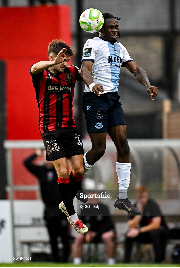 1 August 2025; Thomas Oluwa of Drogheda United in action against Niall Morahan of Bohemians during the SSE Airtricity Men's Premier Division match between Bohemians and Drogheda United at Dalymount Park in Dublin. Photo by Seb Daly/Sportsfile