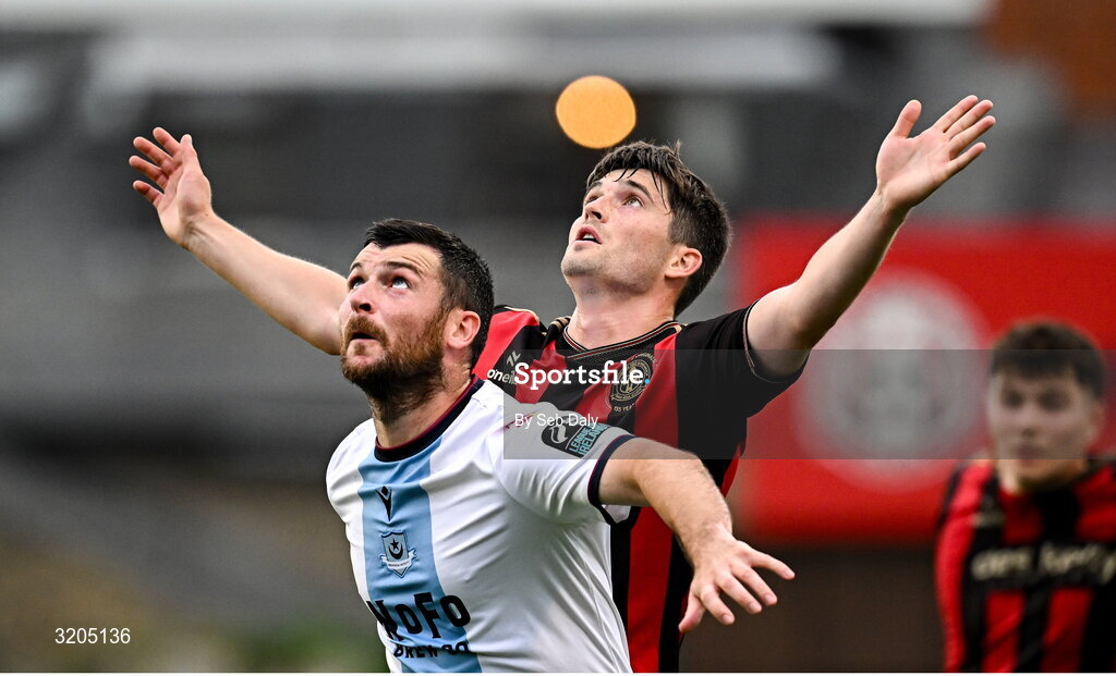 1 August 2025; Colm Whelan of Bohemians and Ryan Brennan of Drogheda United during the SSE Airtricity Men's Premier Division match between Bohemians and Drogheda United at Dalymount Park in Dublin. Photo by Seb Daly/Sportsfile