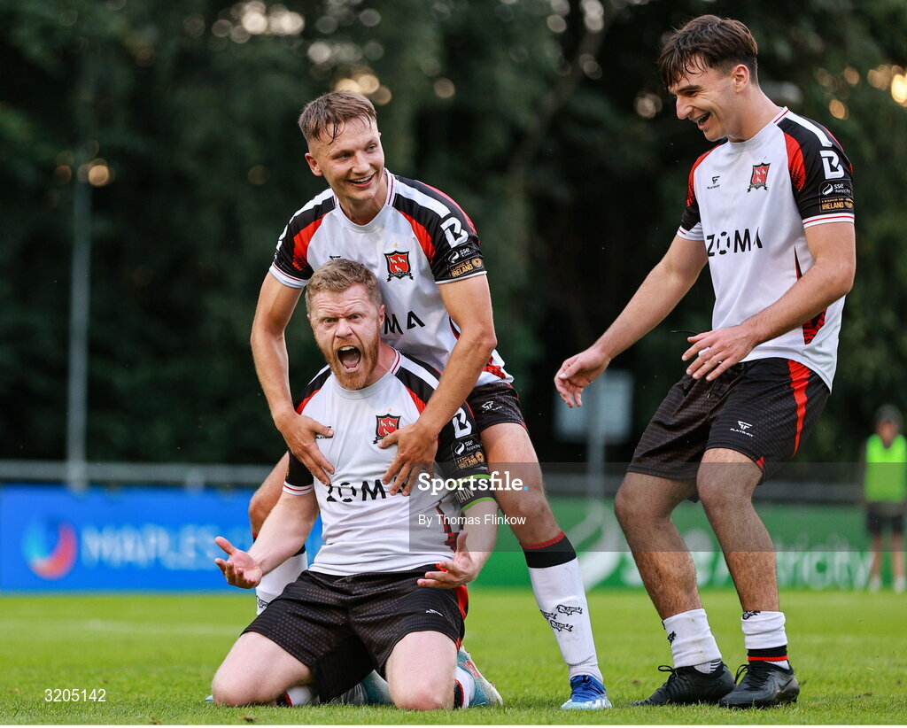1 August 2025; Daryl Horgan of Dundalk, front, celebrates with teammates John Ross Wilson, back, and Andy Paraschiv after scoring his side's first goal, a penalty, during the SSE Airtricity Men's First Division match between UCD and Dundalk at UCD Bowl in Belfield, Dublin. Photo by Thomas Flinkow/Sportsfile