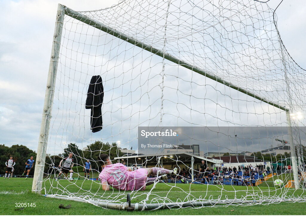 1 August 2025; UCD goalkeeper Dara Kavanagh is beaten Daryl Horgan of Dundalk, third from left, for his side's first goal, a penalty, during the SSE Airtricity Men's First Division match between UCD and Dundalk at UCD Bowl in Belfield, Dublin. Photo by Thomas Flinkow/Sportsfile