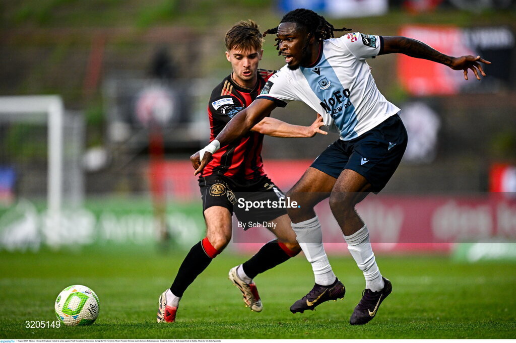 1 August 2025; Thomas Oluwa of Drogheda United in action against Niall Morahan of Bohemians during the SSE Airtricity Men's Premier Division match between Bohemians and Drogheda United at Dalymount Park in Dublin. Photo by Seb Daly/Sportsfile
