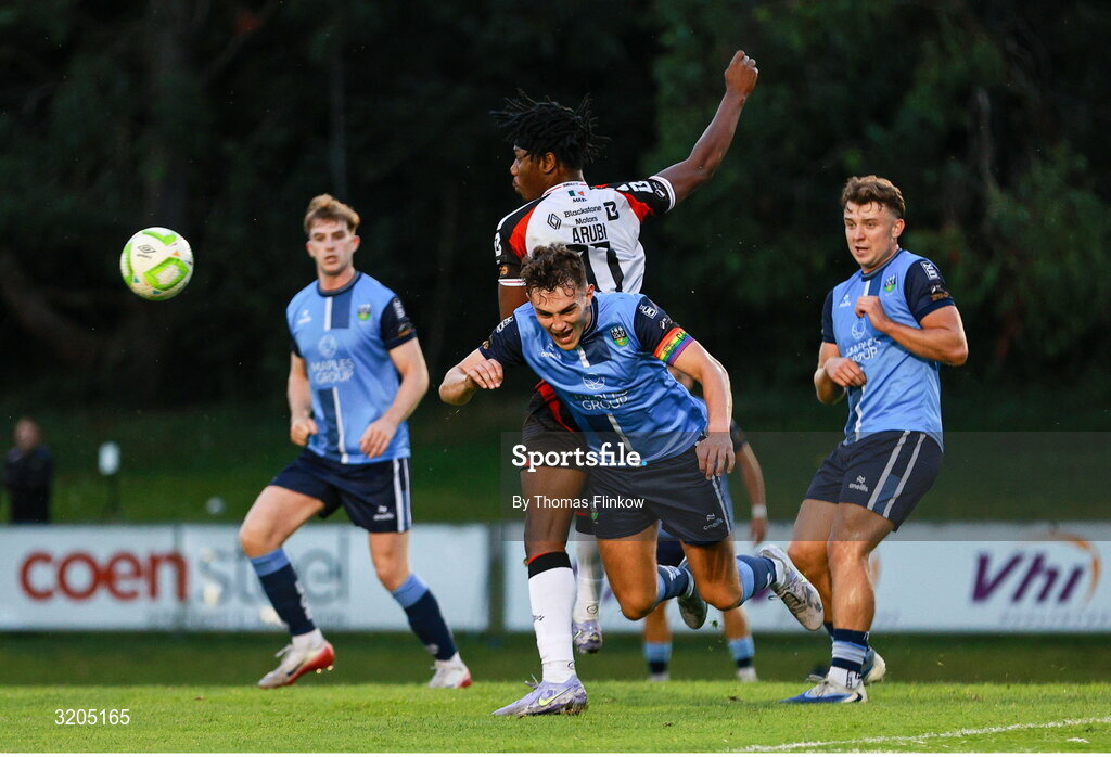 1 August 2025; Eanna Clancy of UCD is tackled by Gbemi Arubi of Dundalk during the SSE Airtricity Men's First Division match between UCD and Dundalk at UCD Bowl in Belfield, Dublin. Photo by Thomas Flinkow/Sportsfile