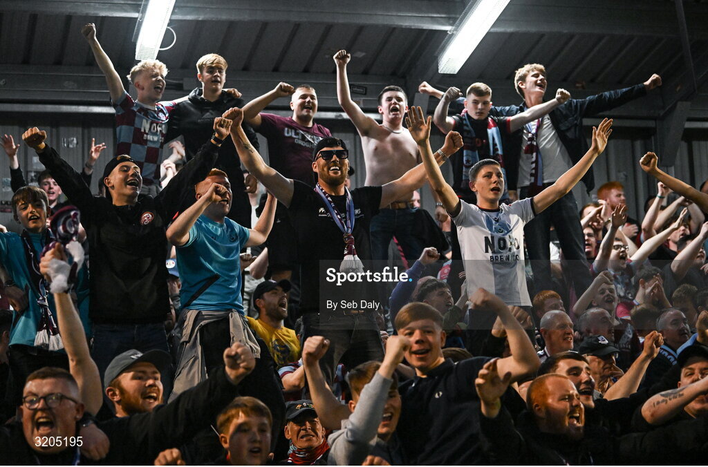 1 August 2025; Drogheda United supporters celebrate after his side's victory in the SSE Airtricity Men's Premier Division match between Bohemians and Drogheda United at Dalymount Park in Dublin. Photo by Seb Daly/Sportsfile