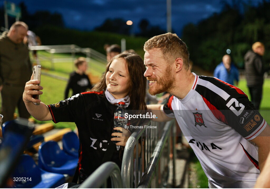 1 August 2025; Daryl Horgan of Dundalk has his photo taken with a supporter after the SSE Airtricity Men's First Division match between UCD and Dundalk at UCD Bowl in Belfield, Dublin. Photo by Thomas Flinkow/Sportsfile