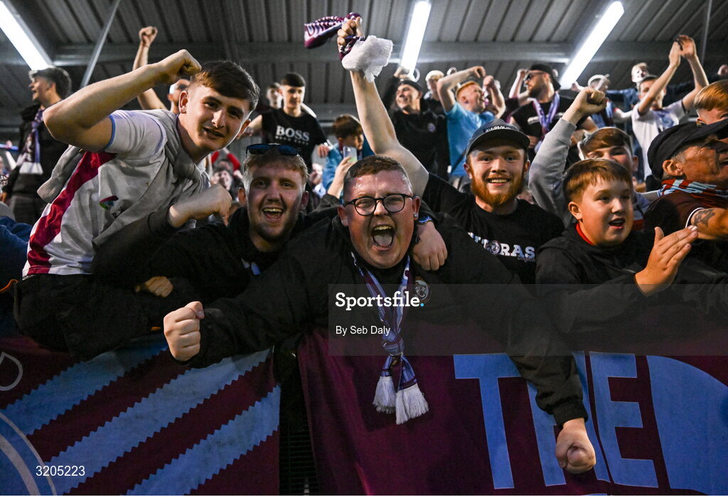 1 August 2025; Drogheda United supporters celebrate after their side's victory in the SSE Airtricity Men's Premier Division match between Bohemians and Drogheda United at Dalymount Park in Dublin. Photo by Seb Daly/Sportsfile