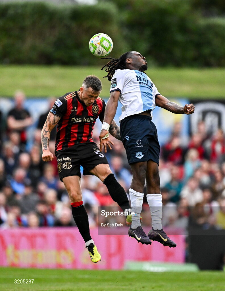 1 August 2025; Thomas Oluwa of Drogheda United in action against Rob Cornwall of Bohemians during the SSE Airtricity Men's Premier Division match between Bohemians and Drogheda United at Dalymount Park in Dublin. Photo by Seb Daly/Sportsfile