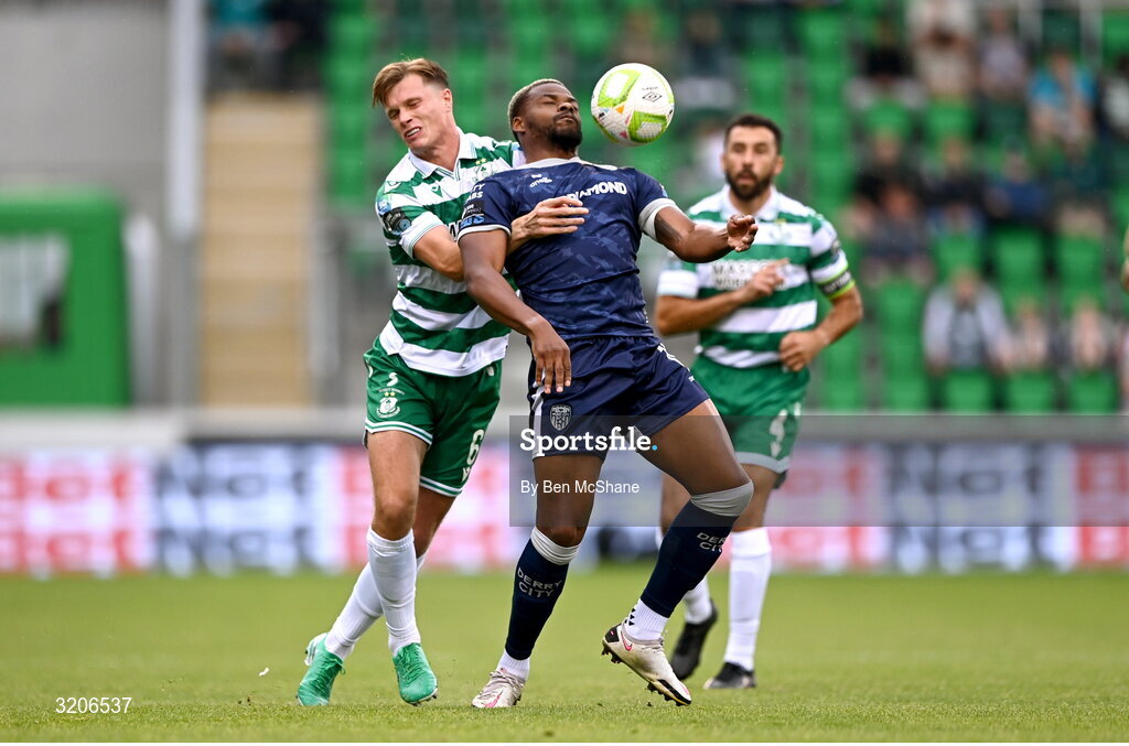3 August 2025; Dipo Akinyemi of Derry City in action against Daniel Cleary of Shamrock Rovers during the SSE Airtricity Men's Premier Division match between Shamrock Rovers and Derry City at Tallaght Stadium in Dublin.  Photo by Ben McShane/Sportsfile