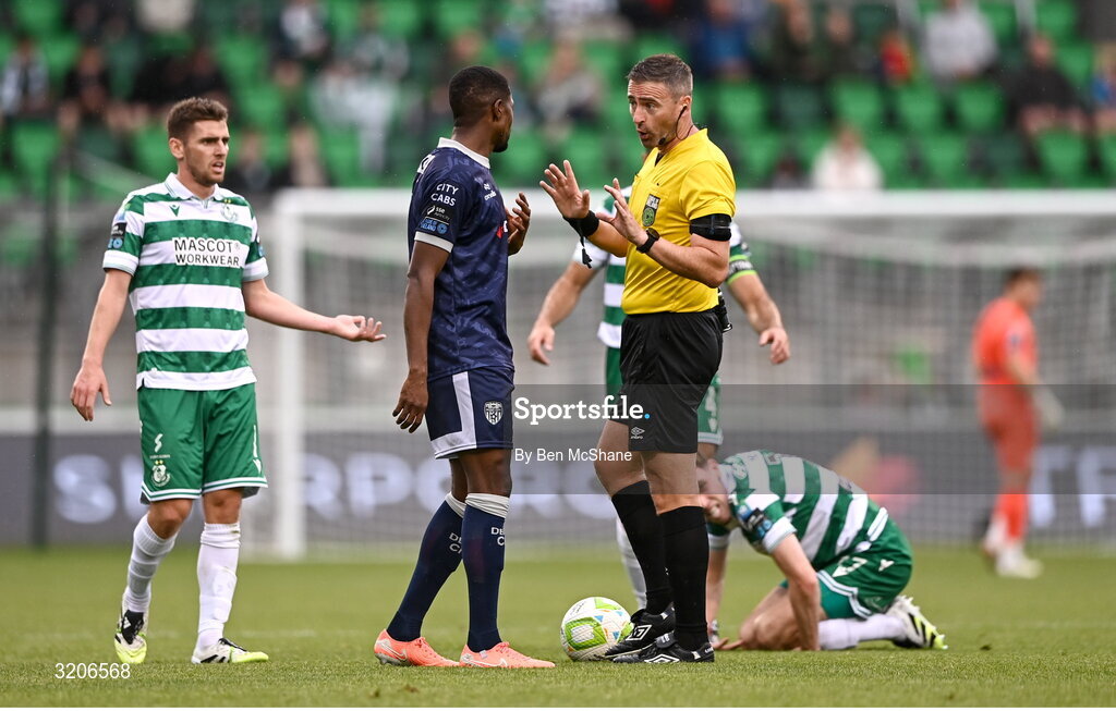 3 August 2025; Referee Paul McLaughlin in conversation with Sadou Diallo of Derry City during the SSE Airtricity Men's Premier Division match between Shamrock Rovers and Derry City at Tallaght Stadium in Dublin.  Photo by Ben McShane/Sportsfile