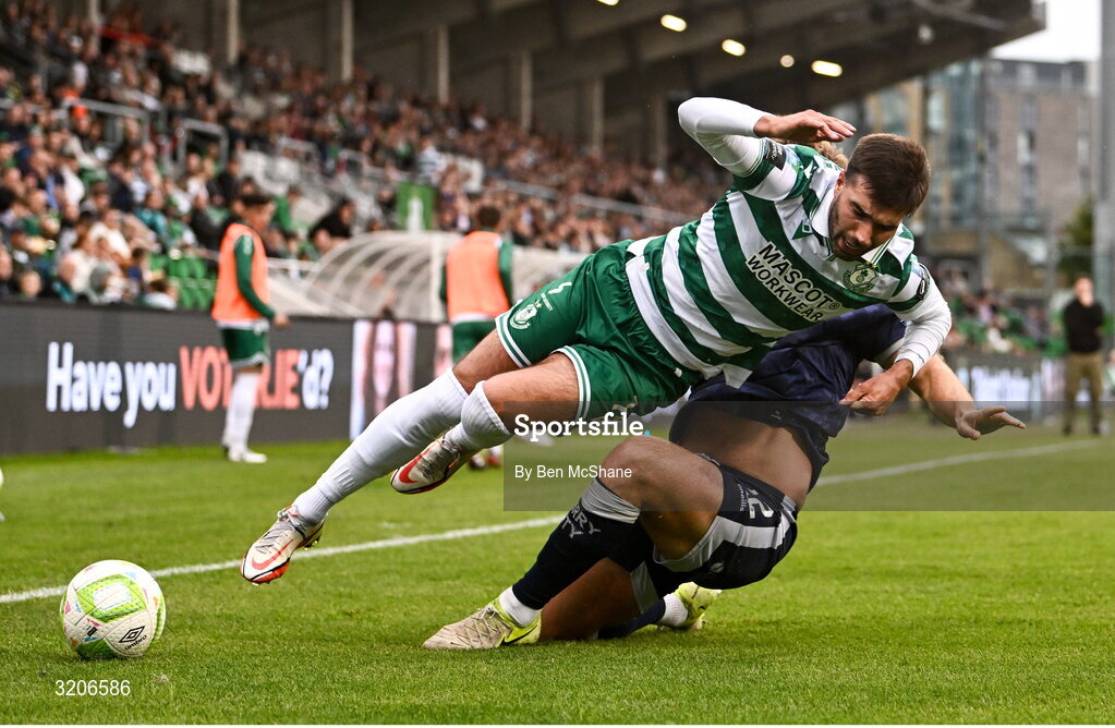 3 August 2025; Danny Mandroiu of Shamrock Rovers in action against Jamie Stott of Derry City during the SSE Airtricity Men's Premier Division match between Shamrock Rovers and Derry City at Tallaght Stadium in Dublin.  Photo by Ben McShane/Sportsfile