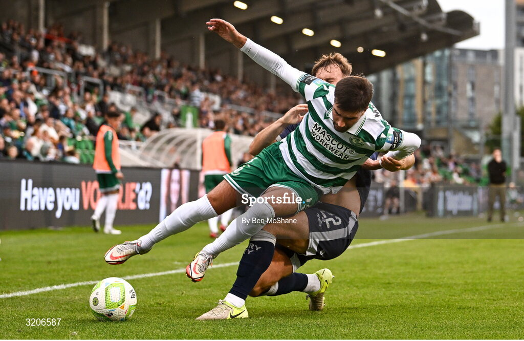 3 August 2025; Danny Mandroiu of Shamrock Rovers in action against Jamie Stott of Derry City during the SSE Airtricity Men's Premier Division match between Shamrock Rovers and Derry City at Tallaght Stadium in Dublin.  Photo by Ben McShane/Sportsfile