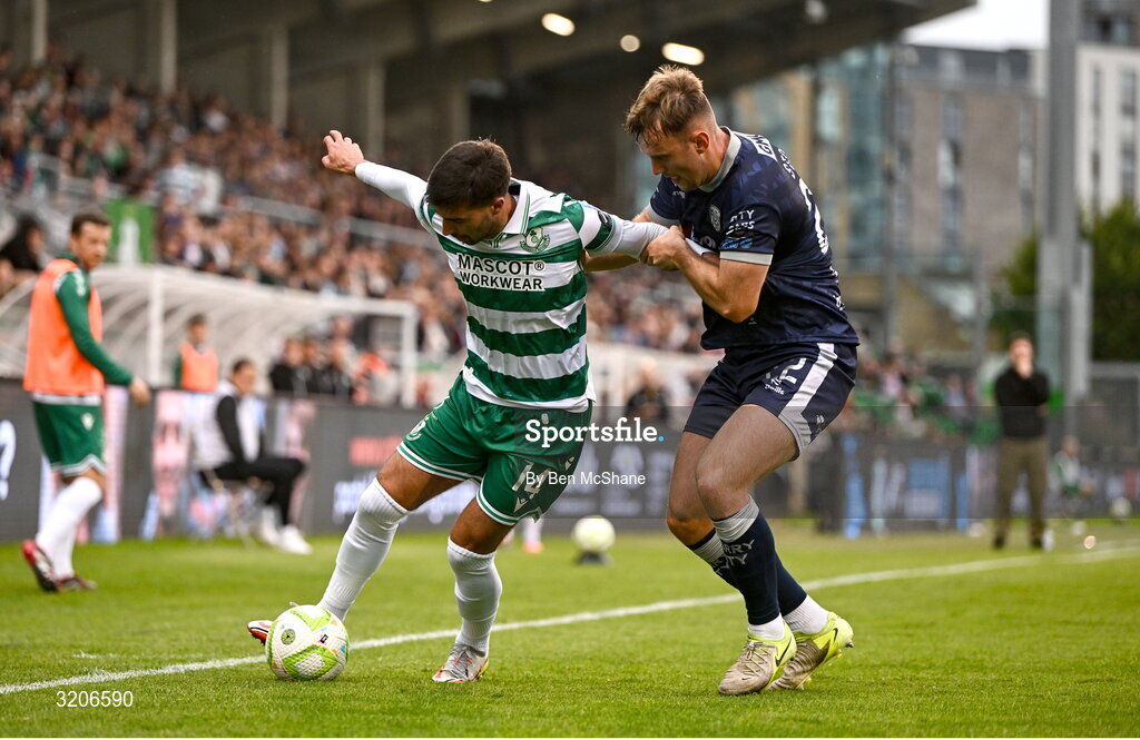 3 August 2025; Danny Mandroiu of Shamrock Rovers in action against Jamie Stott of Derry City during the SSE Airtricity Men's Premier Division match between Shamrock Rovers and Derry City at Tallaght Stadium in Dublin.  Photo by Ben McShane/Sportsfile