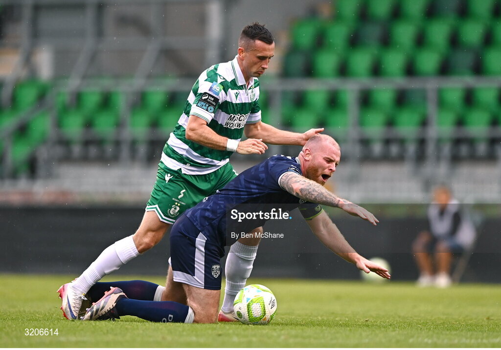 3 August 2025; Mark Connolly of Derry City is tackled by Aaron McEneff of Shamrock Rovers during the SSE Airtricity Men's Premier Division match between Shamrock Rovers and Derry City at Tallaght Stadium in Dublin.  Photo by Ben McShane/Sportsfile