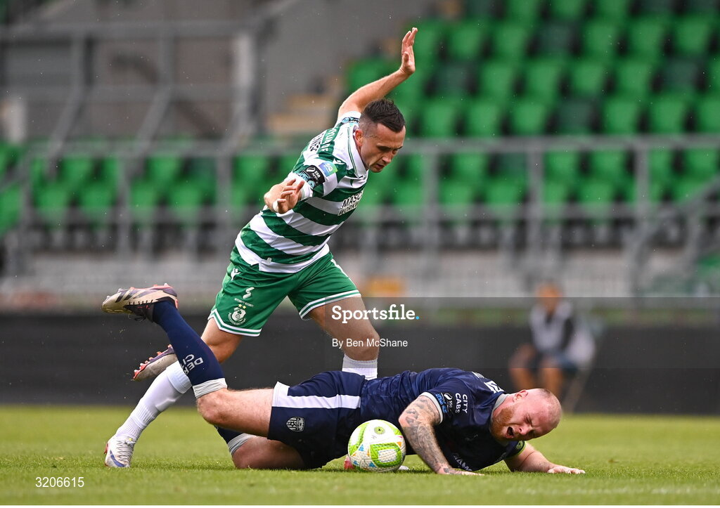 3 August 2025; Mark Connolly of Derry City is tackled by Aaron McEneff of Shamrock Rovers during the SSE Airtricity Men's Premier Division match between Shamrock Rovers and Derry City at Tallaght Stadium in Dublin.  Photo by Ben McShane/Sportsfile