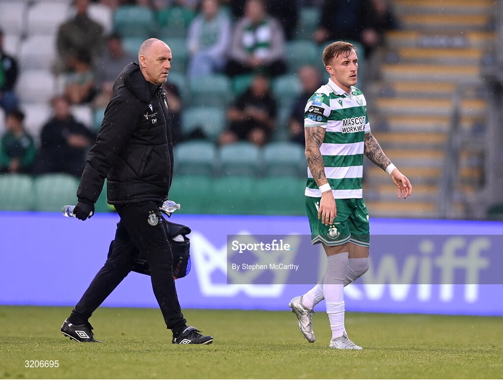 3 August 2025; Danny Grant of Shamrock Rovers leaves the pitch with physiotherapist Tony McCarthy during the SSE Airtricity Men's Premier Division match between Shamrock Rovers and Derry City at Tallaght Stadium in Dublin.  Photo by Stephen McCarthy/Sportsfile