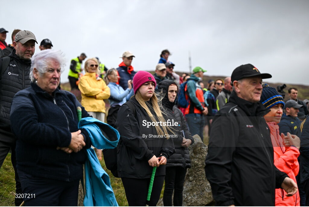 4 August 2025; Spectators stand for the playing of Amhrán na bhFiann ahead of the M. Donnelly GAA Poc Fada All-Ireland Finals at Annaverna Mountain in the Cooley Peninsula, Ravensdale, Louth. Photo by Shauna Clinton/Sportsfile