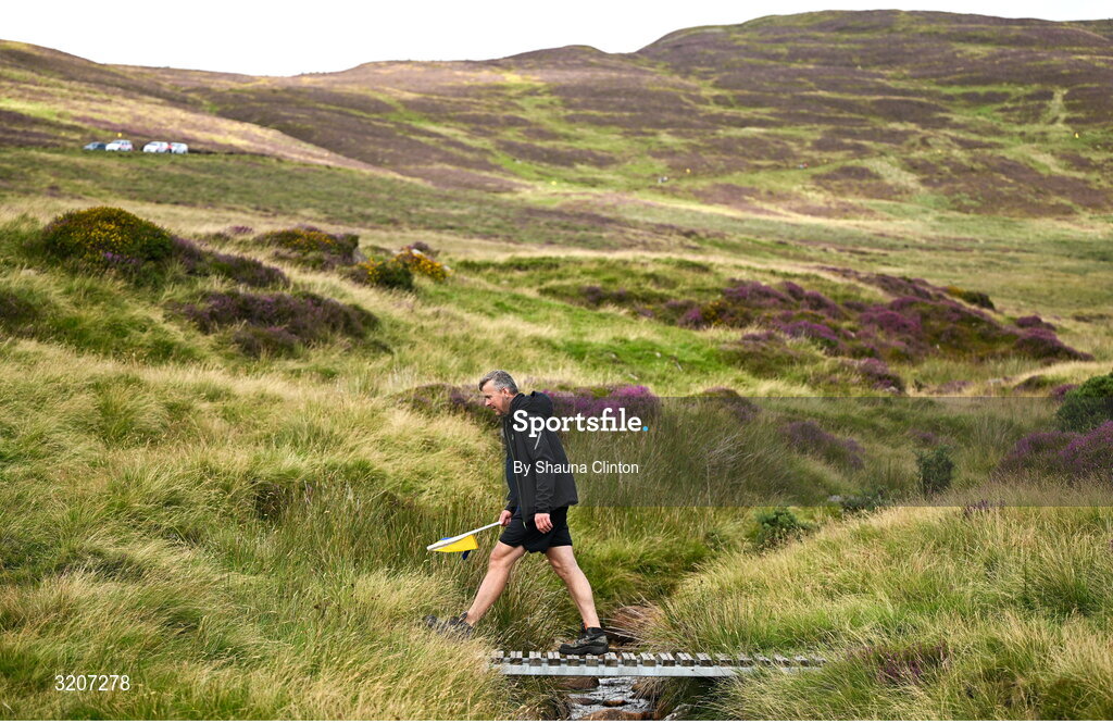 4 August 2025; A steward crosses a small bridge during the M. Donnelly GAA Poc Fada All-Ireland Finals at Annaverna Mountain in the Cooley Peninsula, Ravensdale, Louth. Photo by Shauna Clinton/Sportsfile