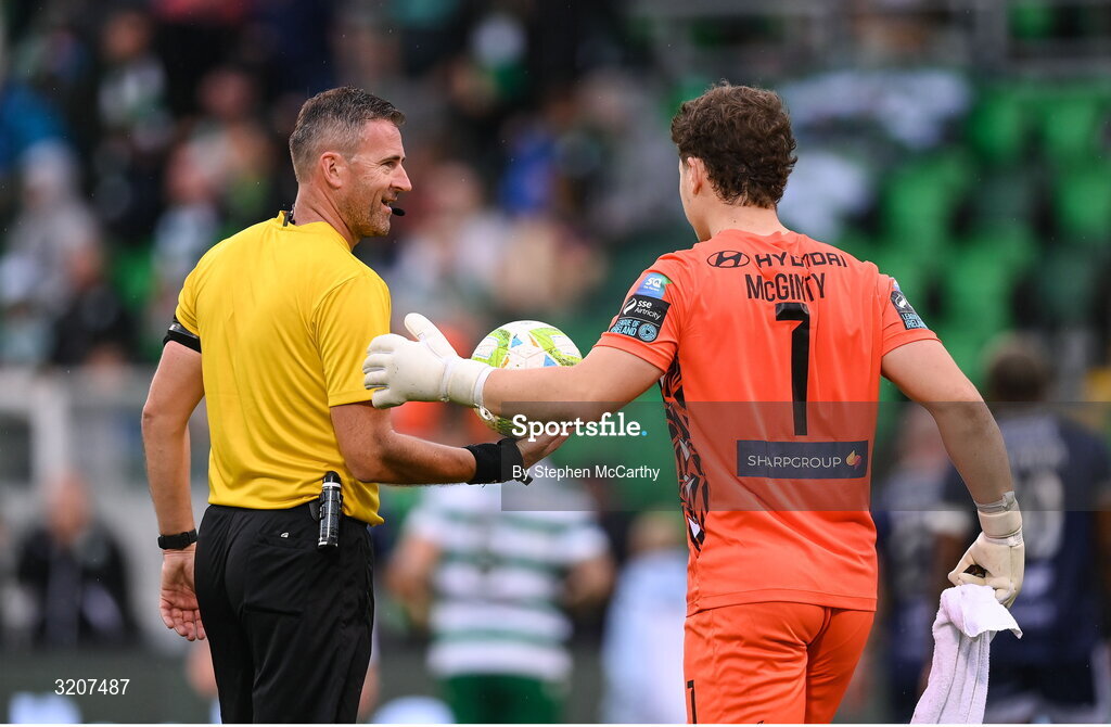 3 August 2025; Referee Paul McLaughlin and Shamrock Rovers goalkeeper Ed McGinty at half-time of the SSE Airtricity Men's Premier Division match between Shamrock Rovers and Derry City at Tallaght Stadium in Dublin.  Photo by Stephen McCarthy/Sportsfile