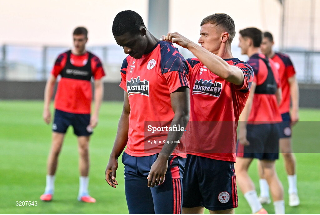 5 August 2025; JJ Lunney, right, helps Mipo Odubeko during a Shelbourne training session at HNK Rijeka Stadium Rujevica in Croatia. Photo by Igor Kupljenik/Sportsfile