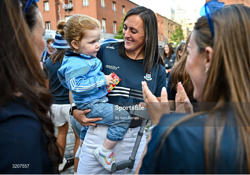 5 August 2025; Hannah Tyrrell of Dublin, with her daughter Aoife, age 2, during the homecoming of TG4 All-Ireland Ladies Senior Football Champions, Dublin, at Smithfield Square in Dublin. Photo by Sam Barnes/Sportsfile
