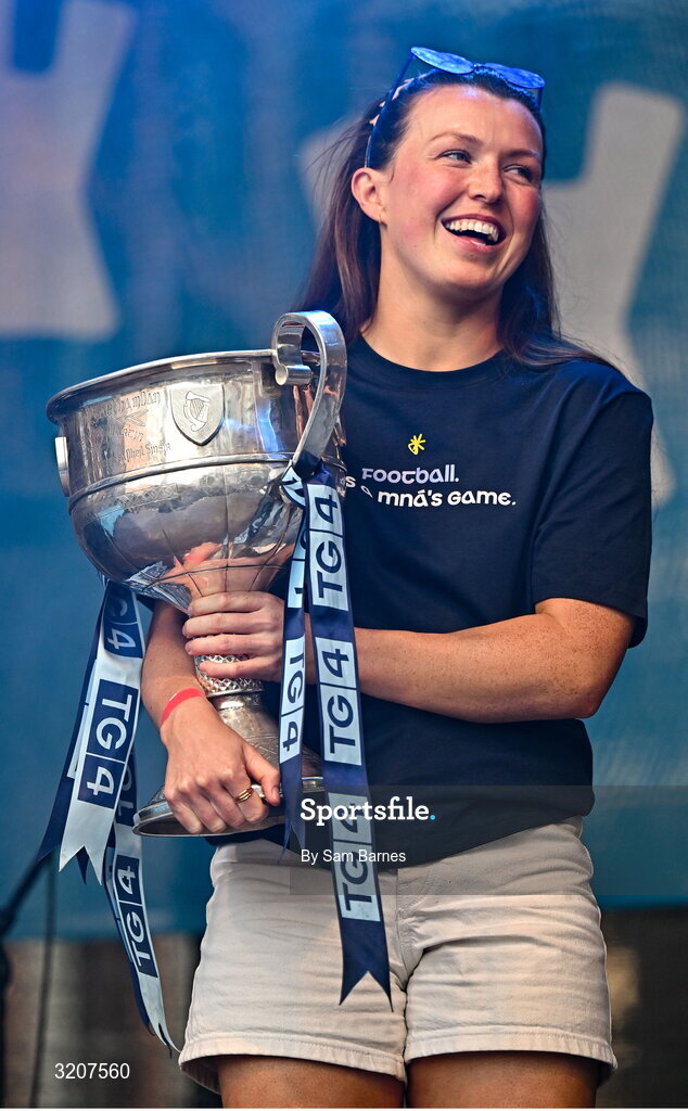 5 August 2025; Leah Caffrey holds The Brendan Martin Cup during the homecoming of TG4 All-Ireland Ladies Senior Football Champions, Dublin, at Smithfield Square in Dublin. Photo by Sam Barnes/Sportsfile
