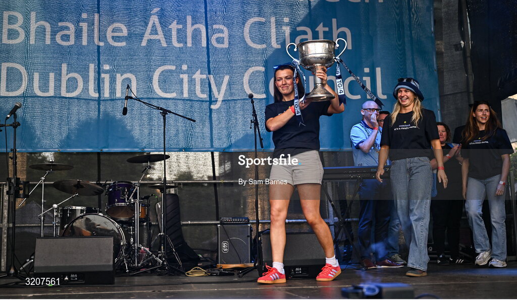 5 August 2025; Leah Caffrey with The Brendan Martin Cup during the homecoming of TG4 All-Ireland Ladies Senior Football Champions, Dublin, at Smithfield Square in Dublin. Photo by Sam Barnes/Sportsfile