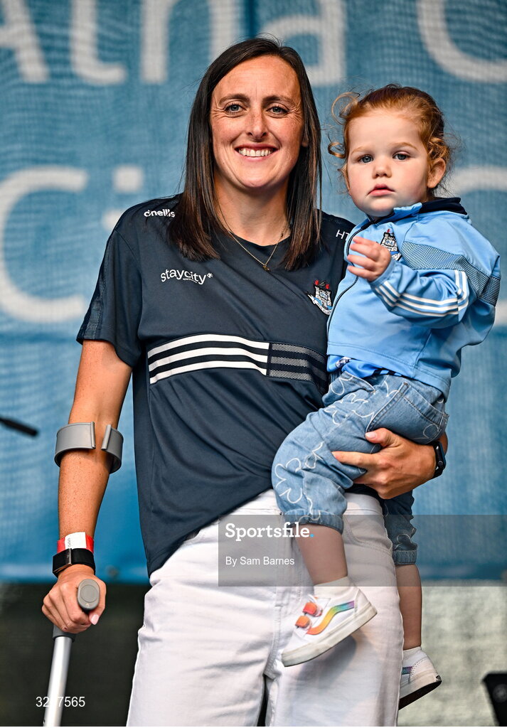 5 August 2025; Hannah Tyrrell with her daughter Aoife, age 2, during the homecoming of TG4 All-Ireland Ladies Senior Football Champions, Dublin, at Smithfield Square in Dublin. Photo by Sam Barnes/Sportsfile
