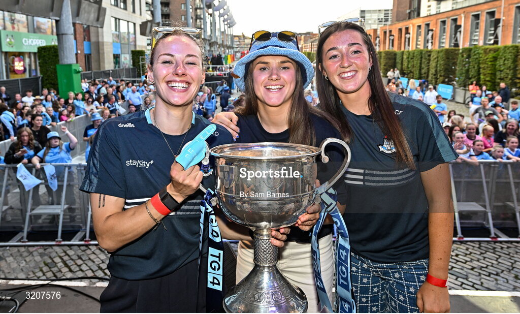 5 August 2025; Dublin players, from left, Nicole Owens, Kate Sullivan and Clodagh Fox with The Brendan Martin Cup during the homecoming of TG4 All-Ireland Ladies Senior Football Champions, Dublin, at Smithfield Square in Dublin. Photo by Sam Barnes/Sportsfile