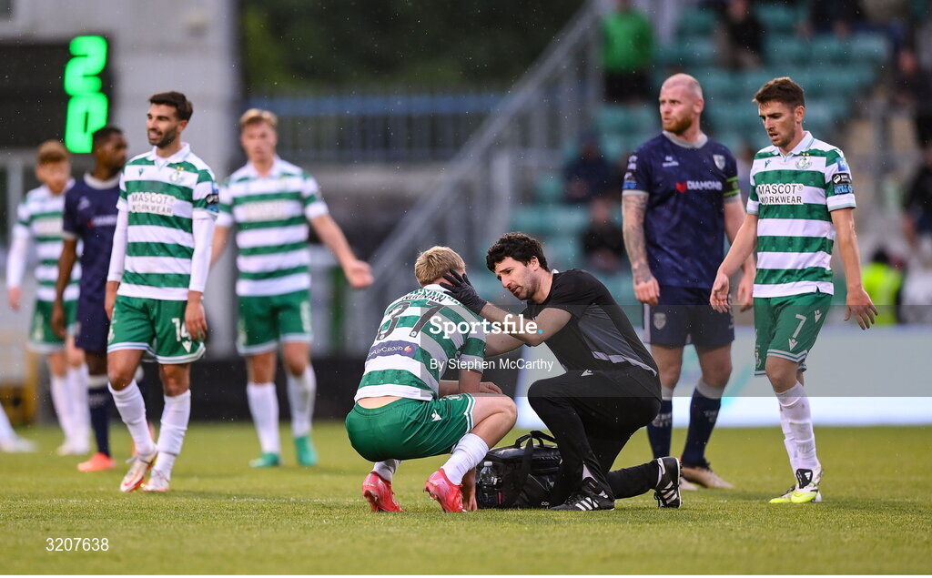 3 August 2025; Michael Noonan of Shamrock Rovers receives medical attention from Shamrock Rovers physiotherapist David White during the SSE Airtricity Men's Premier Division match between Shamrock Rovers and Derry City at Tallaght Stadium in Dublin.  Photo by Stephen McCarthy/Sportsfile