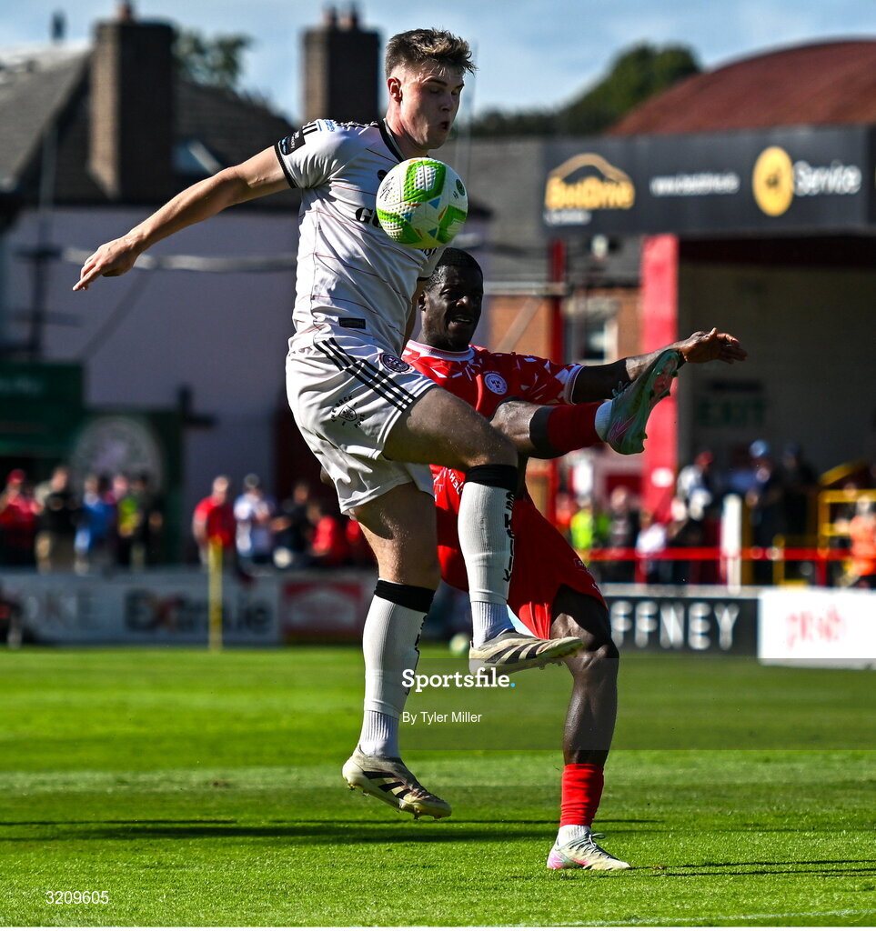 9 August 2025; Mipo Odubeko of Shelbourne in action against Leigh Kavanagh of Bohemians during the SSE Airtricity Men's Premier Division match between Shelbourne and Bohemians at Tolka Park in Dublin. Photo by Tyler Miller/Sportsfile