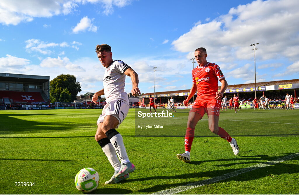 9 August 2025; Dayle Rooney of Bohemians in action against Evan Caffrey of Shelbourne during the SSE Airtricity Men's Premier Division match between Shelbourne and Bohemians at Tolka Park in Dublin. Photo by Tyler Miller/Sportsfile