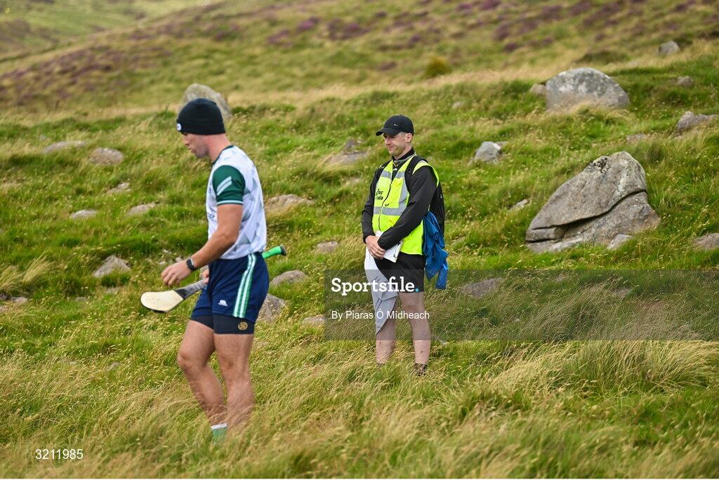 4 August 2025; Fionan Mackessy of Kilkenny competing in the Senior Hurling competition as official Seán Stack looks on during the M. Donnelly GAA Poc Fada All-Ireland Finals at Annaverna Mountain in the Cooley Peninsula, Ravensdale, Louth. Photo by Piaras Ó Mídheach/Sportsfile