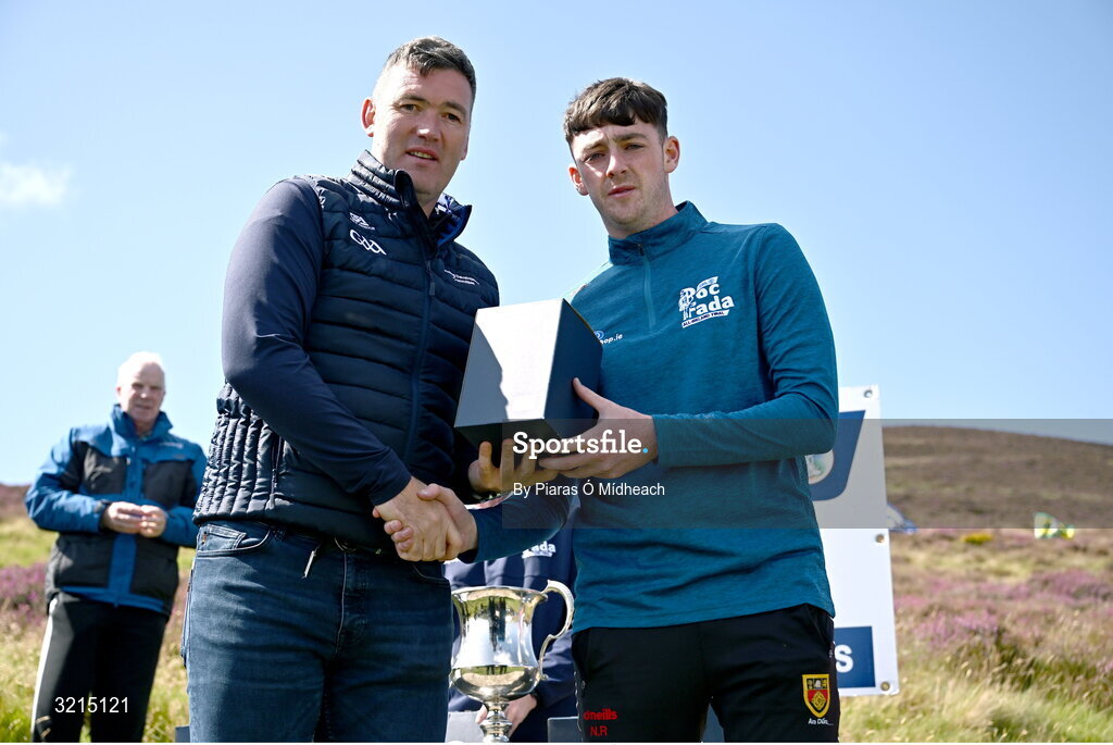 4 August 2025; GAA National Head of Hurling Willie Maher, left, makes a presentation to Pearse Smyth of Down after the M. Donnelly GAA Poc Fada All-Ireland Finals at Annaverna Mountain in the Cooley Peninsula, Ravensdale, Louth. Photo by Piaras Ó Mídheach/Sportsfile