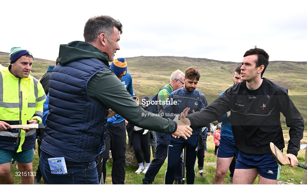 4 August 2025; GAA National Head of Hurling Willie Maher presents a sliotar to Darren Geoghegan of Louth before the M. Donnelly GAA Poc Fada All-Ireland Finals at Annaverna Mountain in the Cooley Peninsula, Ravensdale, Louth. Photo by Piaras Ó Mídheach/Sportsfile