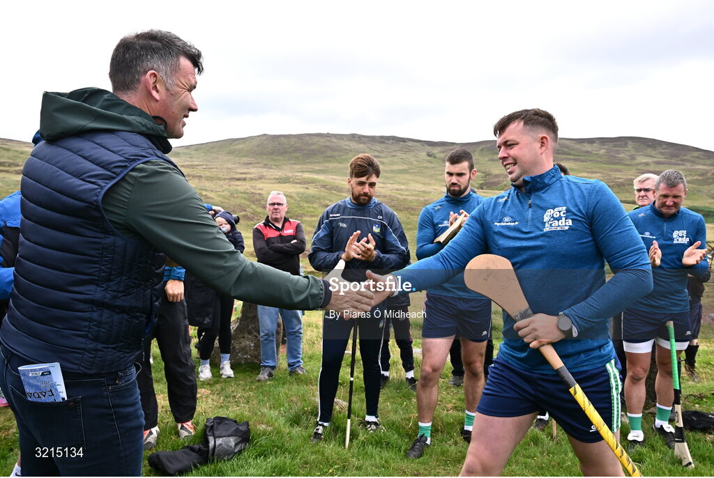 4 August 2025; GAA National Head of Hurling Willie Maher presents a sliotar to Killian Phelan of Kilkenny before the M. Donnelly GAA Poc Fada All-Ireland Finals at Annaverna Mountain in the Cooley Peninsula, Ravensdale, Louth. Photo by Piaras Ó Mídheach/Sportsfile