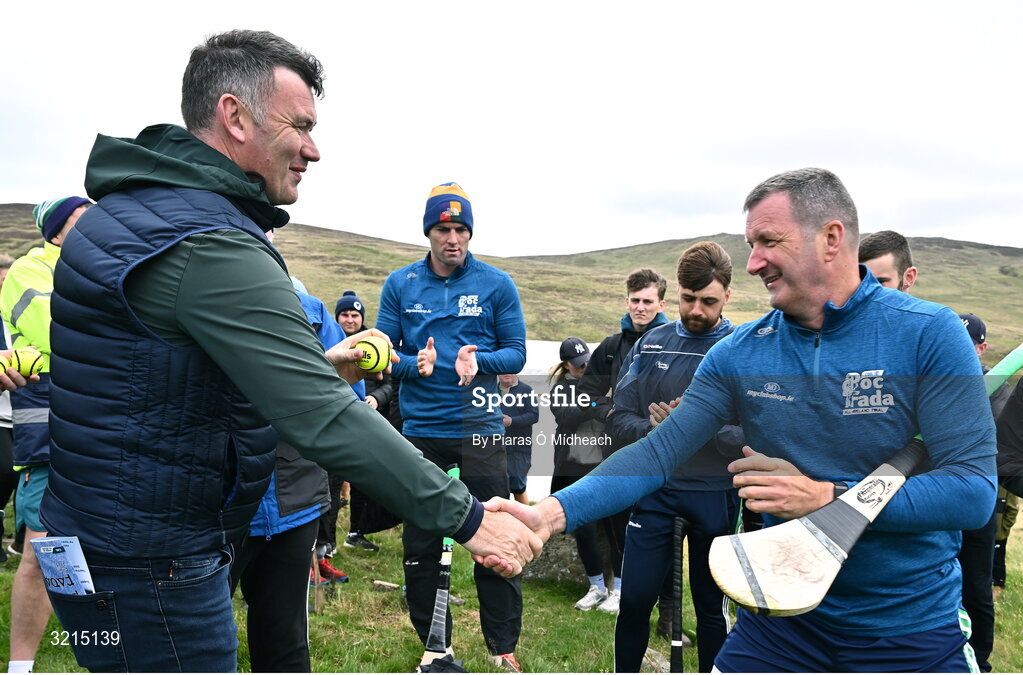 4 August 2025; GAA National Head of Hurling Willie Maher presents a sliotar to Brendan Cummins of Tipperary before the M. Donnelly GAA Poc Fada All-Ireland Finals at Annaverna Mountain in the Cooley Peninsula, Ravensdale, Louth. Photo by Piaras Ó Mídheach/Sportsfile