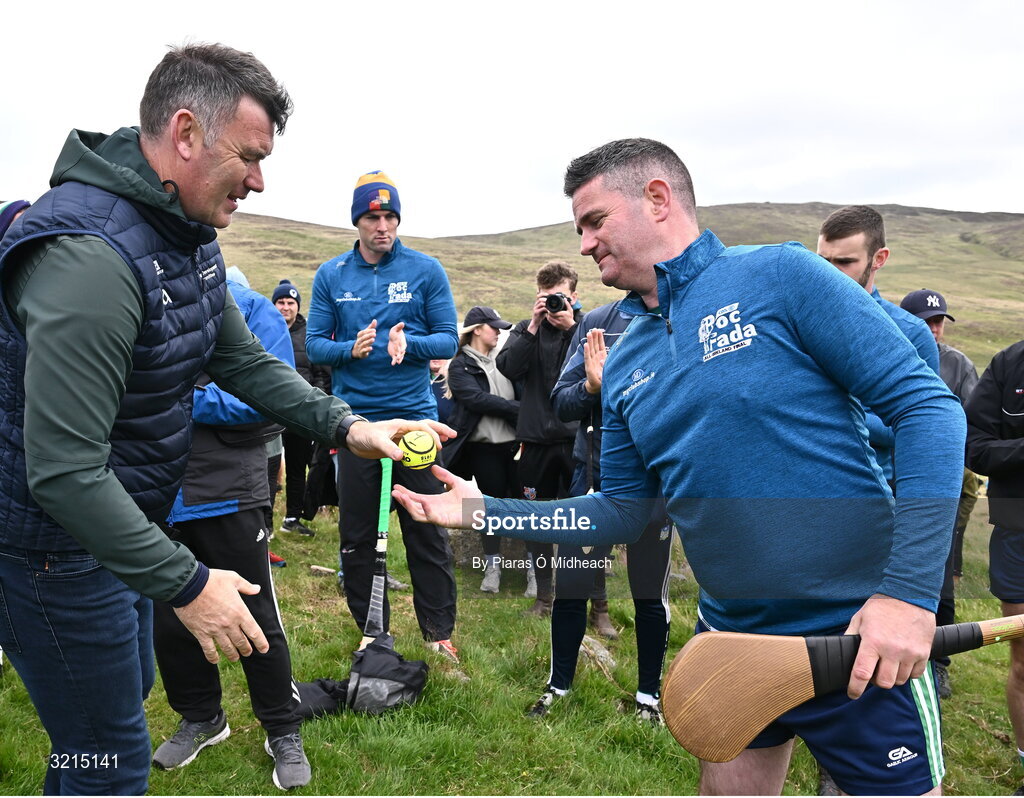 4 August 2025; GAA National Head of Hurling Willie Maher presents a sliotar to Pat Burke of Westmeath before the M. Donnelly GAA Poc Fada All-Ireland Finals at Annaverna Mountain in the Cooley Peninsula, Ravensdale, Louth. Photo by Piaras Ó Mídheach/Sportsfile