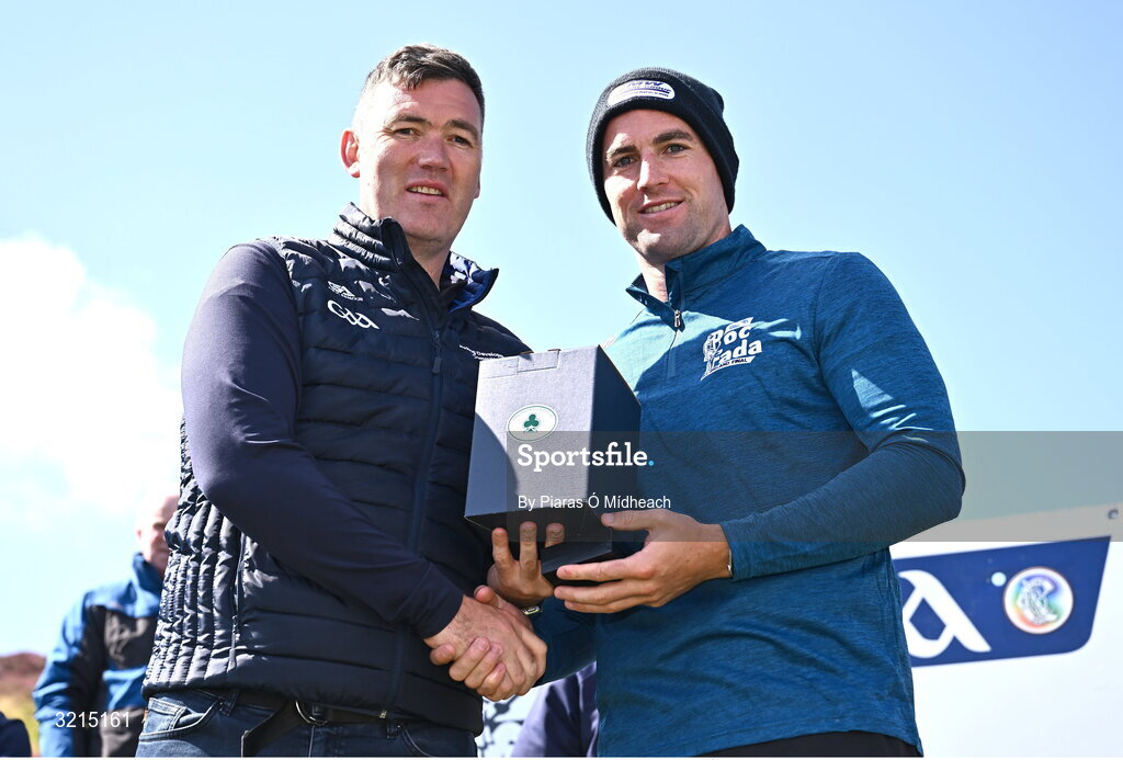 4 August 2025; GAA National Head of Hurling Willie Maher, left, makes a presentation to Fionan Mackessy of Kilkenny after the M. Donnelly GAA Poc Fada All-Ireland Finals at Annaverna Mountain in the Cooley Peninsula, Ravensdale, Louth. Photo by Piaras Ó Mídheach/Sportsfile