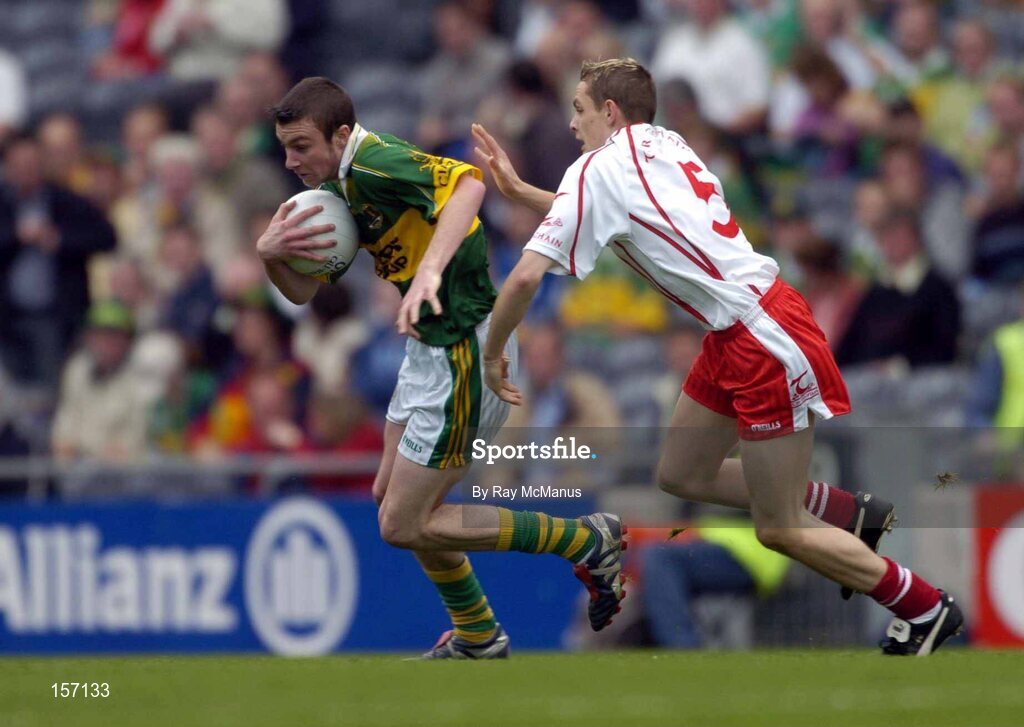 26 September 2004; Rory Keating, Kerry, in action against John Gilmore, Tyrone. All-Ireland Minor Football Championship Final, Kerry v Tyrone, Croke Park, Dublin. Picture credit; Ray McManus / SPORTSFILE *** Local Caption *** Any photograph taken by SPORTSFILE during, or in connection with, the 2004 All-Ireland Minor Football Final which displays GAA logos or contains an image or part of an image of any GAA intellectual property, or, which contains images of a GAA player/players in their playing uniforms, may only be used for editorial and non-advertising purposes.  Use of photographs for advertising, as posters or for purchase separately is strictly prohibited unless prior written approval has been obtained from the Gaelic Athletic Association.
