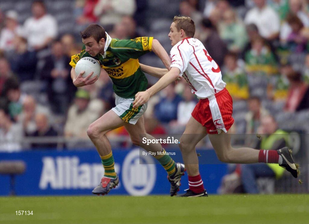 26 September 2004; Rory Keating, Kerry, in action against John Gilmore, Tyrone. All-Ireland Minor Football Championship Final, Kerry v Tyrone, Croke Park, Dublin. Picture credit; Ray McManus / SPORTSFILE *** Local Caption *** Any photograph taken by SPORTSFILE during, or in connection with, the 2004 All-Ireland Minor Football Final which displays GAA logos or contains an image or part of an image of any GAA intellectual property, or, which contains images of a GAA player/players in their playing uniforms, may only be used for editorial and non-advertising purposes.  Use of photographs for advertising, as posters or for purchase separately is strictly prohibited unless prior written approval has been obtained from the Gaelic Athletic Association.