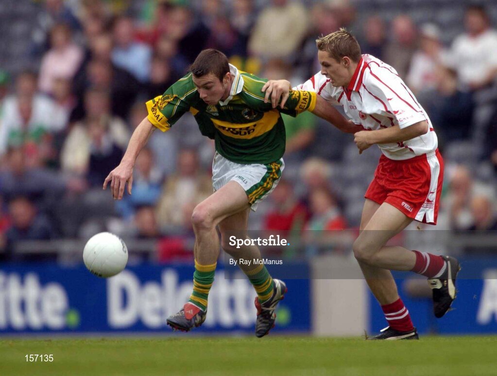 26 September 2004; Rory Keating, Kerry, in action against John Gilmore, Tyrone. All-Ireland Minor Football Championship Final, Kerry v Tyrone, Croke Park, Dublin. Picture credit; Ray McManus / SPORTSFILE *** Local Caption *** Any photograph taken by SPORTSFILE during, or in connection with, the 2004 All-Ireland Minor Football Final which displays GAA logos or contains an image or part of an image of any GAA intellectual property, or, which contains images of a GAA player/players in their playing uniforms, may only be used for editorial and non-advertising purposes.  Use of photographs for advertising, as posters or for purchase separately is strictly prohibited unless prior written approval has been obtained from the Gaelic Athletic Association.