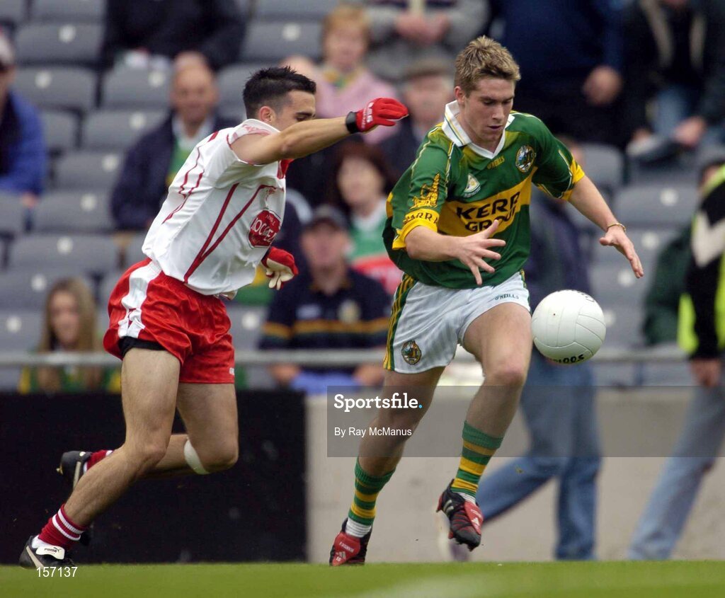 26 September 2004; Paul O'Connor, Kerry, in action against Niall McGinn, Tyrone. All-Ireland Minor Football Championship Final, Kerry v Tyrone, Croke Park, Dublin. Picture credit; Ray McManus / SPORTSFILE *** Local Caption *** Any photograph taken by SPORTSFILE during, or in connection with, the 2004 All-Ireland Minor Football Final which displays GAA logos or contains an image or part of an image of any GAA intellectual property, or, which contains images of a GAA player/players in their playing uniforms, may only be used for editorial and non-advertising purposes.  Use of photographs for advertising, as posters or for purchase separately is strictly prohibited unless prior written approval has been obtained from the Gaelic Athletic Association.