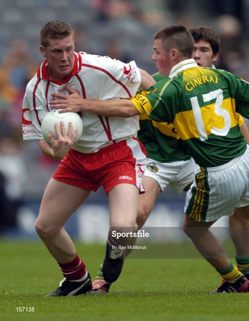 26 September 2004; Marc Cunningham, Tyrone, in action against Shane Murphy, Kerry. All-Ireland Minor Football Championship Final, Kerry v Tyrone, Croke Park, Dublin. Picture credit; Ray McManus / SPORTSFILE *** Local Caption *** Any photograph taken by SPORTSFILE during, or in connection with, the 2004 All-Ireland Minor Football Final which displays GAA logos or contains an image or part of an image of any GAA intellectual property, or, which contains images of a GAA player/players in their playing uniforms, may only be used for editorial and non-advertising purposes.  Use of photographs for advertising, as posters or for purchase separately is strictly prohibited unless prior written approval has been obtained from the Gaelic Athletic Association.