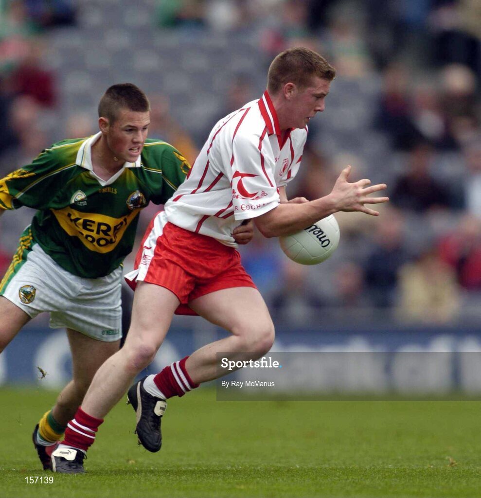 26 September 2004; Marc Cunningham, Tyrone, in action against Shane Murphy, Kerry. All-Ireland Minor Football Championship Final, Kerry v Tyrone, Croke Park, Dublin. Picture credit; Ray McManus / SPORTSFILE *** Local Caption *** Any photograph taken by SPORTSFILE during, or in connection with, the 2004 All-Ireland Minor Football Final which displays GAA logos or contains an image or part of an image of any GAA intellectual property, or, which contains images of a GAA player/players in their playing uniforms, may only be used for editorial and non-advertising purposes.  Use of photographs for advertising, as posters or for purchase separately is strictly prohibited unless prior written approval has been obtained from the Gaelic Athletic Association.