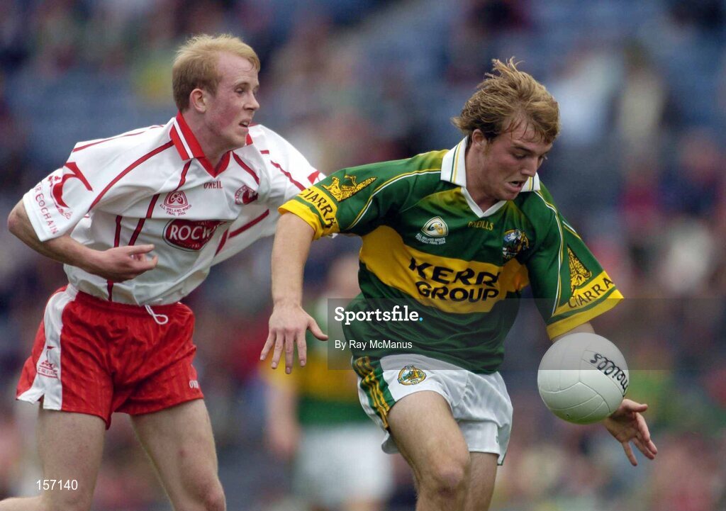 26 September 2004; Darren O'Sullivan, Kerry, in action against Martin Murray, Tyrone. All-Ireland Minor Football Championship Final, Kerry v Tyrone, Croke Park, Dublin. Picture credit; Ray McManus / SPORTSFILE *** Local Caption *** Any photograph taken by SPORTSFILE during, or in connection with, the 2004 All-Ireland Minor Football Final which displays GAA logos or contains an image or part of an image of any GAA intellectual property, or, which contains images of a GAA player/players in their playing uniforms, may only be used for editorial and non-advertising purposes.  Use of photographs for advertising, as posters or for purchase separately is strictly prohibited unless prior written approval has been obtained from the Gaelic Athletic Association.