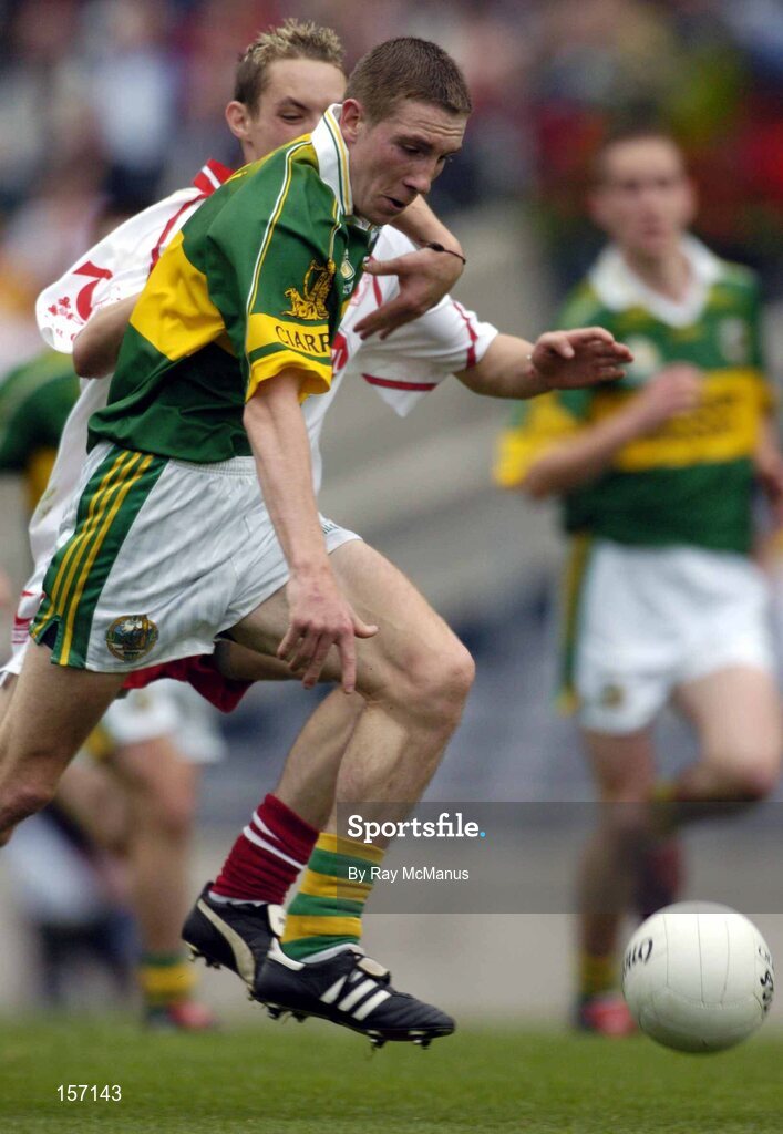 26 September 2004; Andrew Kennelly, Kerry, in action against John Gilmore, Tyrone. All-Ireland Minor Football Championship Final, Kerry v Tyrone, Croke Park, Dublin. Picture credit; Ray McManus / SPORTSFILE *** Local Caption *** Any photograph taken by SPORTSFILE during, or in connection with, the 2004 All-Ireland Minor Football Final which displays GAA logos or contains an image or part of an image of any GAA intellectual property, or, which contains images of a GAA player/players in their playing uniforms, may only be used for editorial and non-advertising purposes.  Use of photographs for advertising, as posters or for purchase separately is strictly prohibited unless prior written approval has been obtained from the Gaelic Athletic Association.