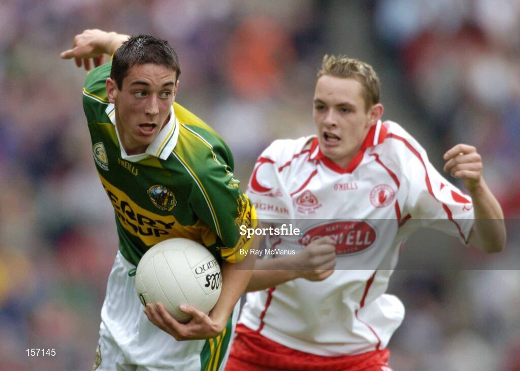 26 September 2004; Anthony Maher, Kerry, in action against John Gilmore, Tyrone. All-Ireland Minor Football Championship Final, Kerry v Tyrone, Croke Park, Dublin. Picture credit; Ray McManus / SPORTSFILE *** Local Caption *** Any photograph taken by SPORTSFILE during, or in connection with, the 2004 All-Ireland Minor Football Final which displays GAA logos or contains an image or part of an image of any GAA intellectual property, or, which contains images of a GAA player/players in their playing uniforms, may only be used for editorial and non-advertising purposes.  Use of photographs for advertising, as posters or for purchase separately is strictly prohibited unless prior written approval has been obtained from the Gaelic Athletic Association.