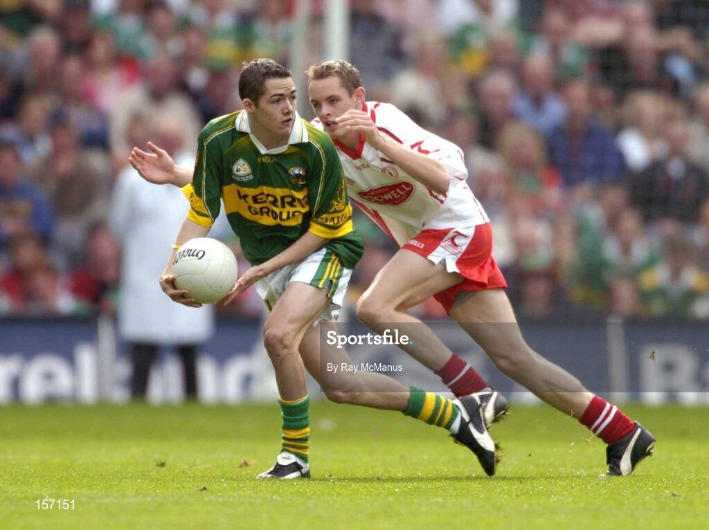 26 September 2004; Brian Looney, Kerry, in action against John Gilmore, Tyrone. All-Ireland Minor Football Championship Final, Kerry v Tyrone, Croke Park, Dublin. Picture credit; Ray McManus / SPORTSFILE *** Local Caption *** Any photograph taken by SPORTSFILE during, or in connection with, the 2004 All-Ireland Minor Football Final which displays GAA logos or contains an image or part of an image of any GAA intellectual property, or, which contains images of a GAA player/players in their playing uniforms, may only be used for editorial and non-advertising purposes.  Use of photographs for advertising, as posters or for purchase separately is strictly prohibited unless prior written approval has been obtained from the Gaelic Athletic Association.