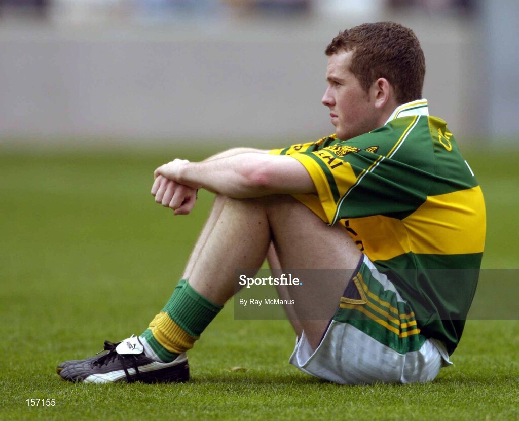 26 September 2004; Luke Quinn, Kerry, shows his dissapointment after defeat against Tyrone. All-Ireland Minor Football Championship Final, Kerry v Tyrone, Croke Park, Dublin. Picture credit; Ray McManus / SPORTSFILE *** Local Caption *** Any photograph taken by SPORTSFILE during, or in connection with, the 2004 All-Ireland Minor Football Final which displays GAA logos or contains an image or part of an image of any GAA intellectual property, or, which contains images of a GAA player/players in their playing uniforms, may only be used for editorial and non-advertising purposes.  Use of photographs for advertising, as posters or for purchase separately is strictly prohibited unless prior written approval has been obtained from the Gaelic Athletic Association.