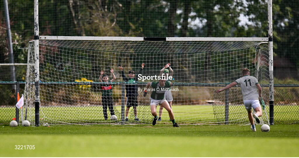 24 August 2025; Young Charlestown Sarsfields supporters try to put off Kuba Callaghan of Ballaghaderreen as he scores a penalty against Gareth O'Donnell of Charlestown Sarsfields during the Mayo County Senior Club Football Championship Round 2 match between Charlestown Sarsfields and Ballaghaderreen at Fr O'Hara Park in Charlestown, Mayo. Photo by Piaras Ó Mídheach/Sportsfile