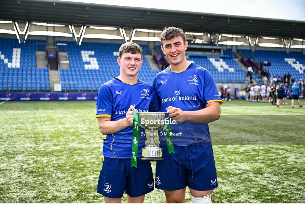 27 August 2025; Leinster players Tommy Smyth, left, and David Kenny celebrate with the trophy after their side's victory in the PwC U-18 Boys Schools Interprovincial Series match between Leinster and Ulster at Energia Park in Dublin. Photo by Piaras Ó Mídheach/Sportsfile
